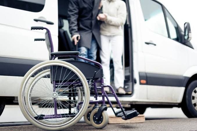 A close up of a wheel chair on the sidewalk